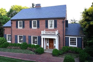 dark blue shutters on red brick house