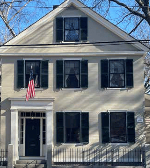 A Greek Revival with Uniform Shutters on both stories
