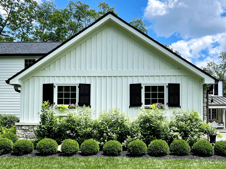 custom louver shutters on exterior of riverside home