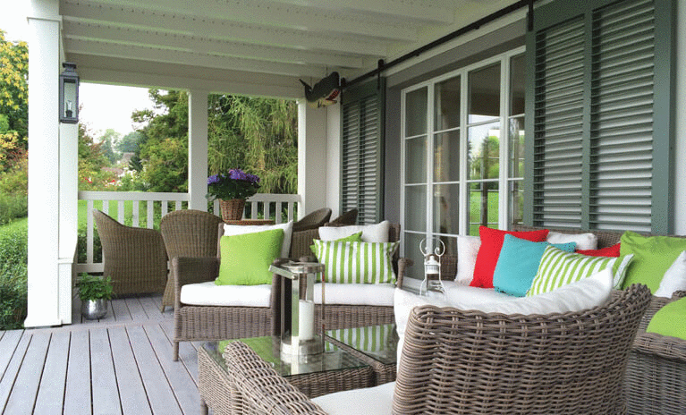 add decorative pillows and cozy blankets to enjoy mornings and evenings outside during Fall