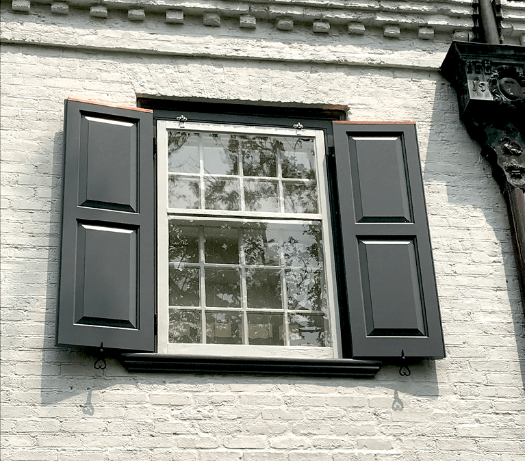 custom panel shutters for historical home restoration by hackley and associates architects