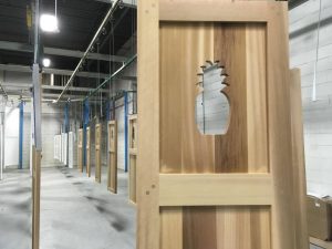 pineapple cutout in wood panel shutter