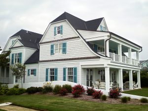 3-story beach house with blue louver shutters