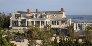 Blue louver and v-Groove panel shutters on beach home