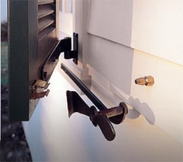 Bullet Nose Catch on black louver shutter on white home