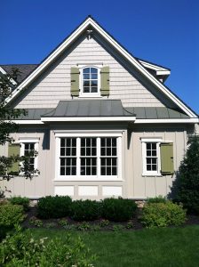 green board and batten shutters with exterior shutter hardware