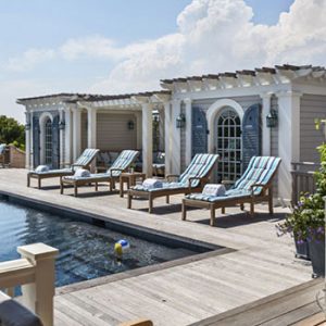 Blue louver and panel combination shutters can add an upscale bump to your pool area