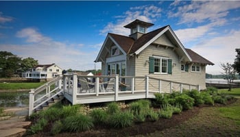 green board and batten shutters on white BEACH HOME