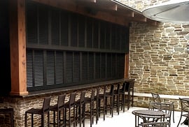 Black bermuda shutters used for a restaurant bar