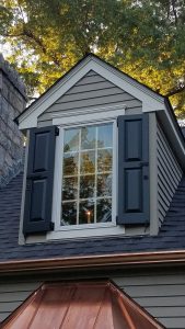 panel shutters on dormer window