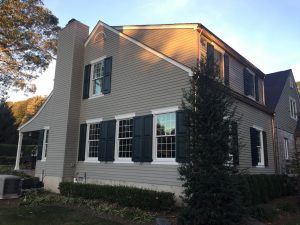 Functional exterior shutters on cape cod home