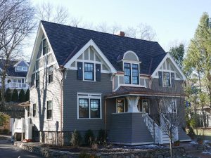 Craftsman style house with board and batten shutters featuring heart-shaped cutout designs.