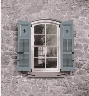 Fleur de Lis cut out on a pair of louvered, panel custom shutters from Timberlane.