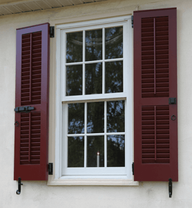 red operable louver shutters with fully functioning hardware