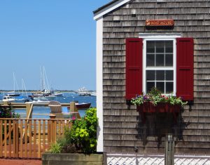 coastal exterior shutters including flat panels with v-groove detail