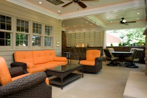 outdoor kitchen with white Bermuda shutters