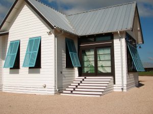 beach house bungalow with blue Bermuda shutters