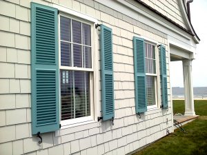 blue fixed louver beach house window shutters