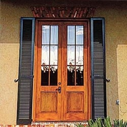 black louver shutters on wooden door