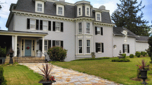 Victorian house with louver and panel exterior shutters