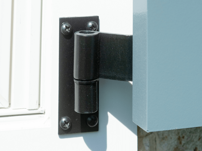 detailed view of a Timberlane fully functional shutter hinge installed on white window casing