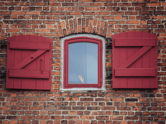 z-brace-board-and-batten-shutters-on-brick-home-1