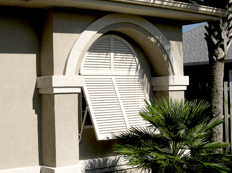 how to style a stucco home with white bermuda shutters