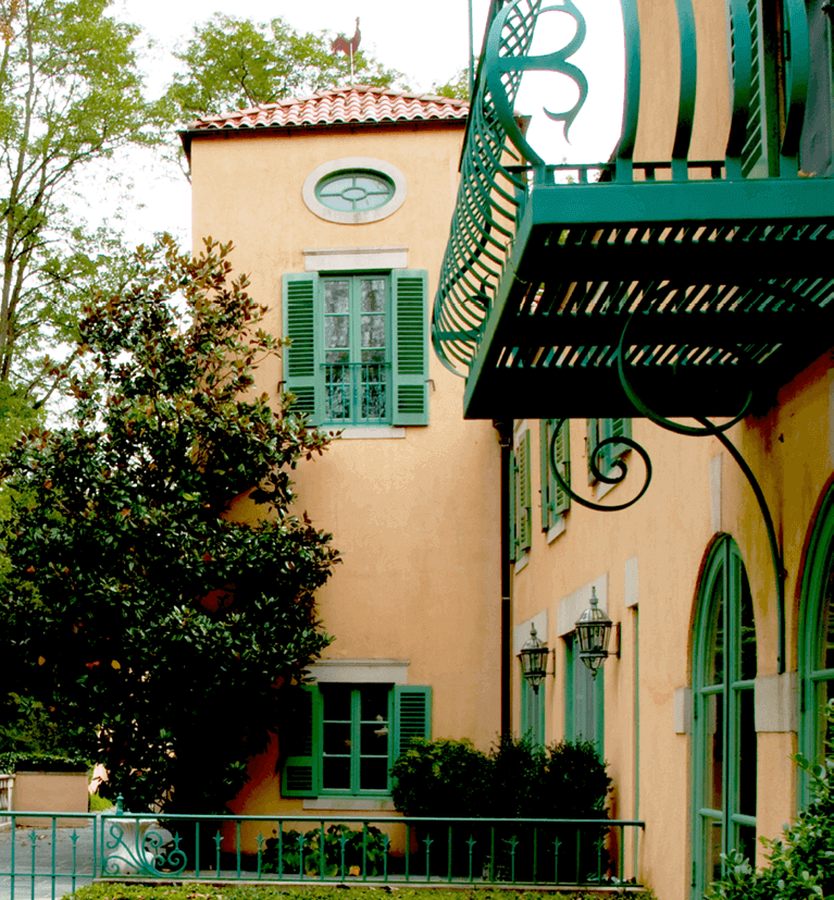 louver exterior shutters for a stucco mediterranean style home