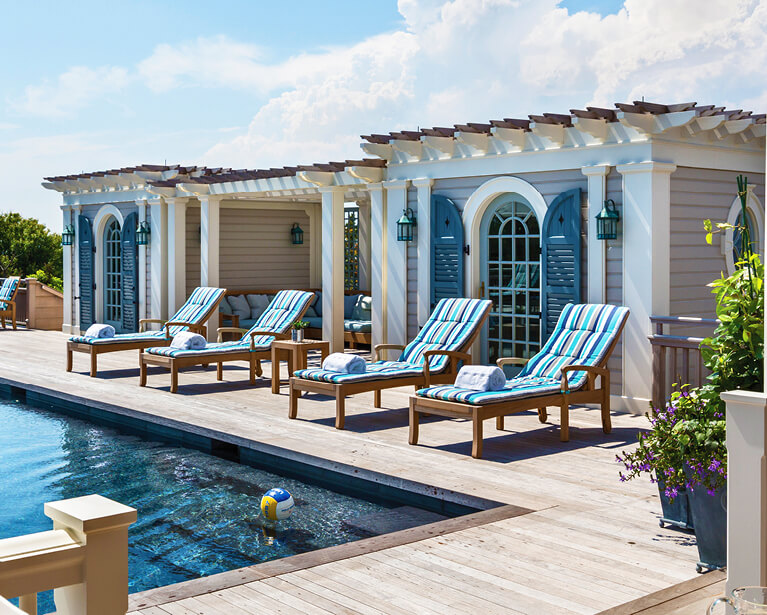 shutters can be used as a backdrop for an outdoor pool oasis or for function to block unwanted sun glare for guests