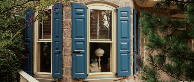 b-Blue-panel-shutter-red-tan-stone-hosue-front-with-radius-tops-frist-floor-windows-cropped-social-edit-NEED