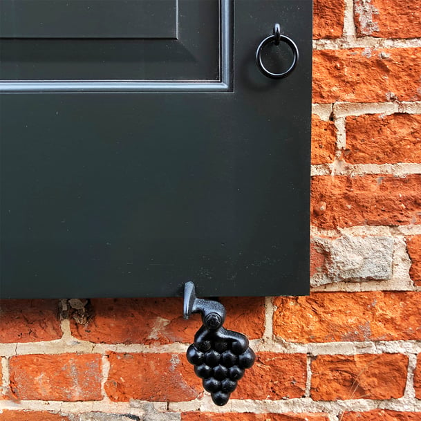 Black panel and louver shutters red brick house single shutter hardware - Doylestown social edit