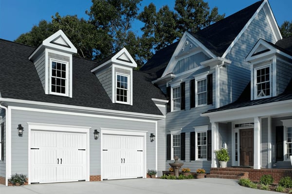 gallery-white-classic-collection-garage-doors-blue-siding-house