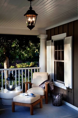 White panel SHUTTERS on brown porch