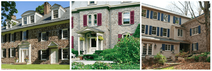 Black, red and blue shutters on stone homes