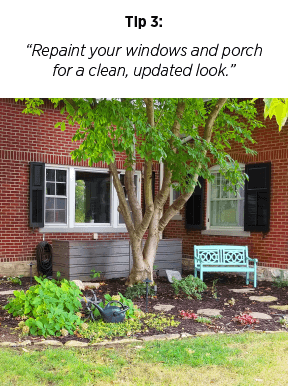 red-brick-home-black-shutters-garden-area