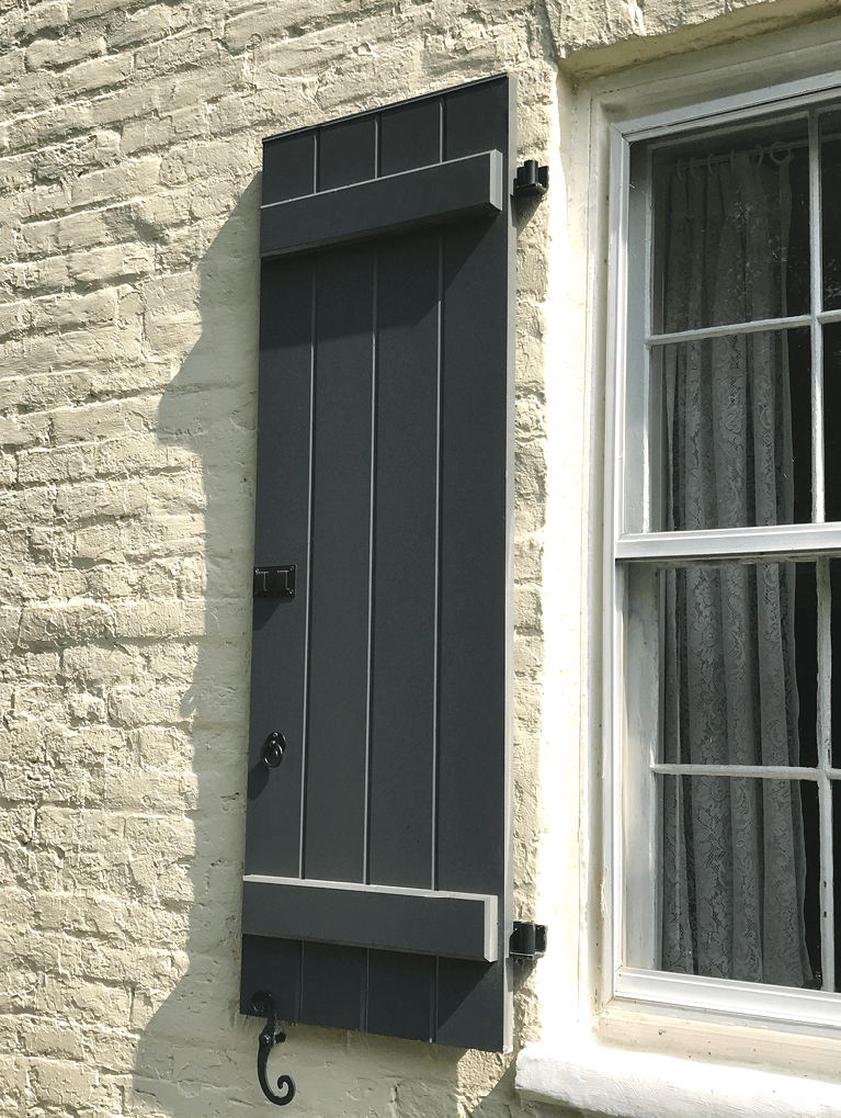 custom board and batten shutters with functional hardware